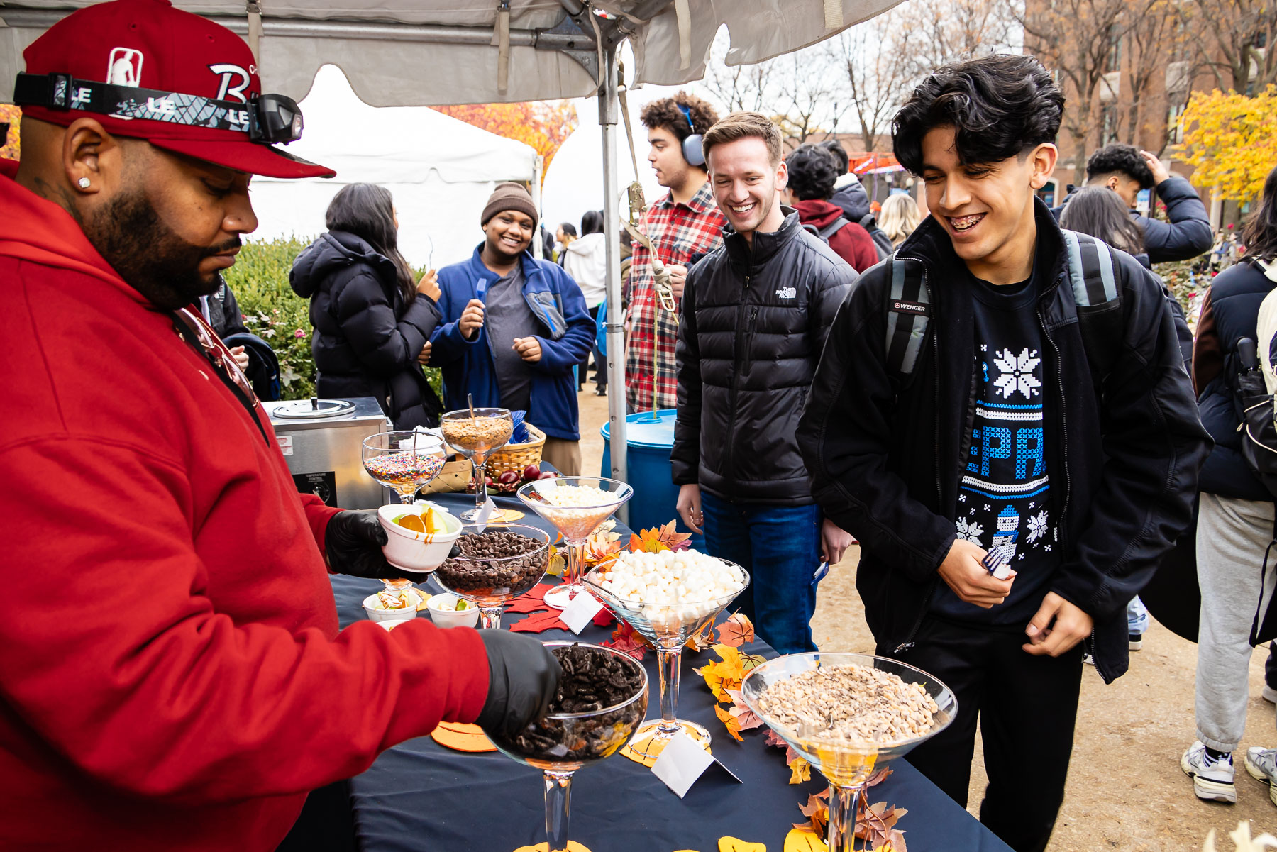 With sweaters in-hand, students were treated to all sorts of delctibles during the party on the Quad. (Photo by Jeff Carrion / DePaul University) 